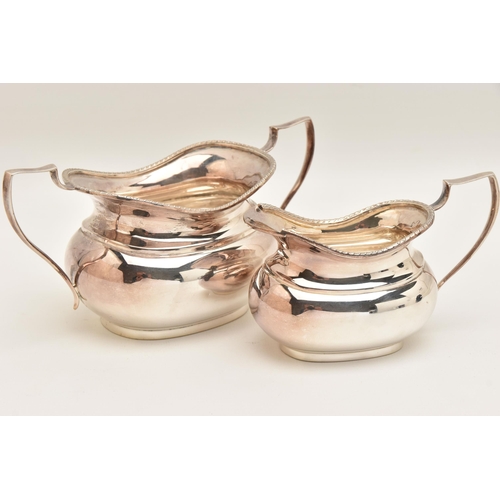 507 - AN ELIZABETH II SILVER SUGAR BOWL AND MILK JUG, polished forms with gadrooned rims and handles, each... 