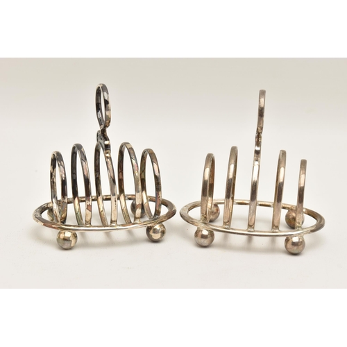 522 - TWO EARLY 20TH CENTURY SILVER TOAST RACKS, both of an oval form with four sections, circular handles... 