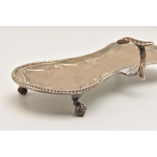 525 - A GEORGE III SILVER CANDLE SNUFFER TRAY, curved tray with beaded rim and worn engraved crest to the ... 