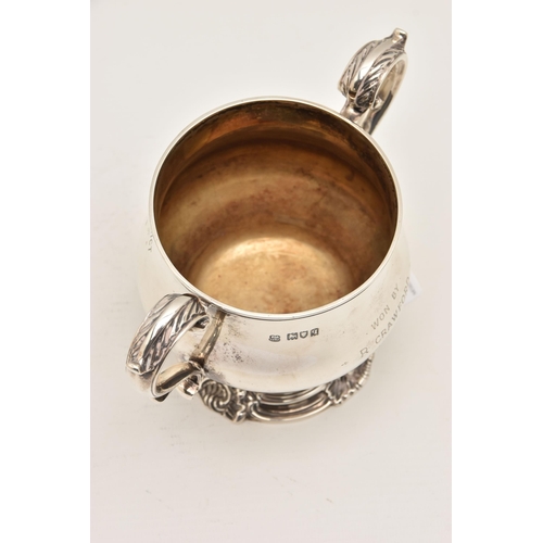 536 - A GEORGE V SILVER PRESENTATION TROPHY CUP, polished baluster form, fitted with two scrolling handles... 