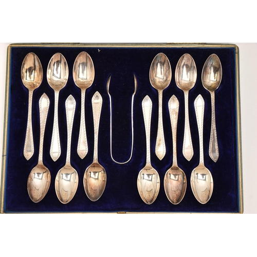 538 - A CASED SET OF EARLY 20TH CENTURY SILVER TEASPOONS AND SUGAR TONGS, to include twelve teaspoons with... 