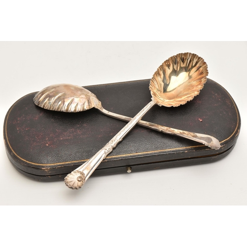 539 - A CASED SET OF TWO SILVER EDWARDIAN FRUIT SPOONS, each with a frilled edge, gilt bowl and shell patt... 