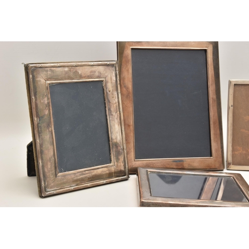 541 - FOUR SILVER PHOTO FRAMES, each of a rectangular form, three with a polished finish the other with a ... 