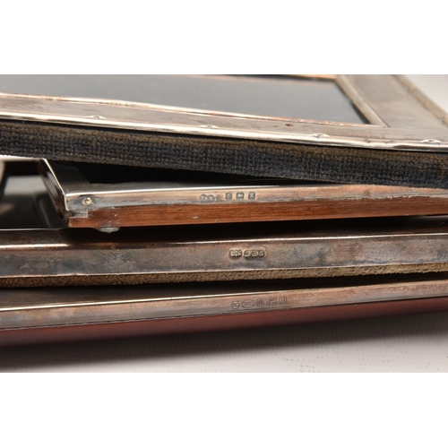 541 - FOUR SILVER PHOTO FRAMES, each of a rectangular form, three with a polished finish the other with a ... 