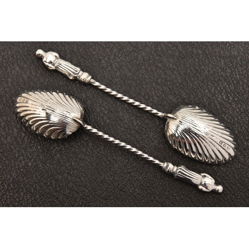 545 - THREE CASED SETS OF SILVER CUTLERY, to include a cased set of six apostle top teaspoons with shell b... 