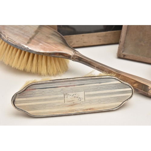 546 - AN ASSORTMENT OF SILVER ITEMS, to include a three piece brush set with engine turned pattern detail,... 