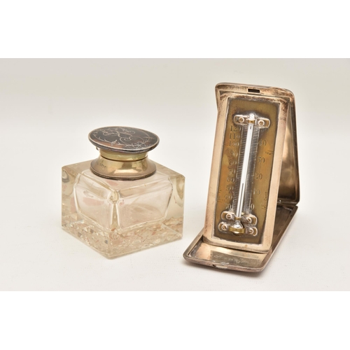 547 - A SILVER CASED THEMOMETER AND A GLASS INK WELL, the polished portable thermometer with engraved mono... 