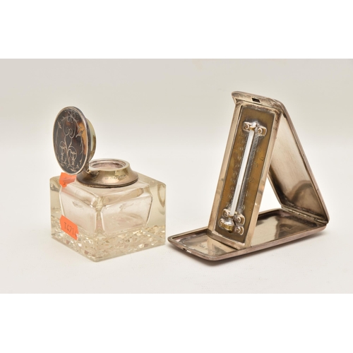 547 - A SILVER CASED THEMOMETER AND A GLASS INK WELL, the polished portable thermometer with engraved mono... 