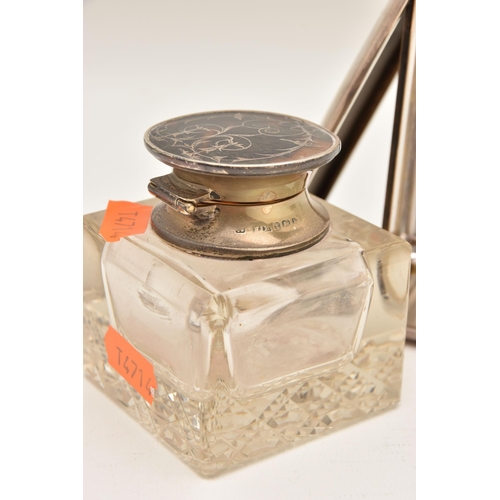 547 - A SILVER CASED THEMOMETER AND A GLASS INK WELL, the polished portable thermometer with engraved mono... 