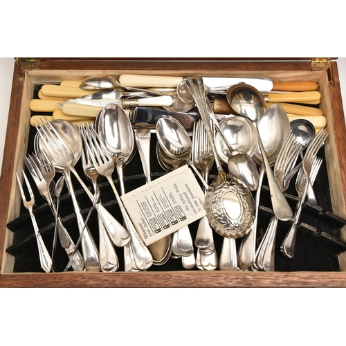 557 - TWO WOODEN CANTEENS OF CUTLERY, the first filled with an eight person place setting of stainless ste... 