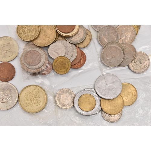 572 - A PLASTIC POT OF MIXED COINS TO INCLUDE A SILVER HINDU GOOD LUCK TOKEN etc