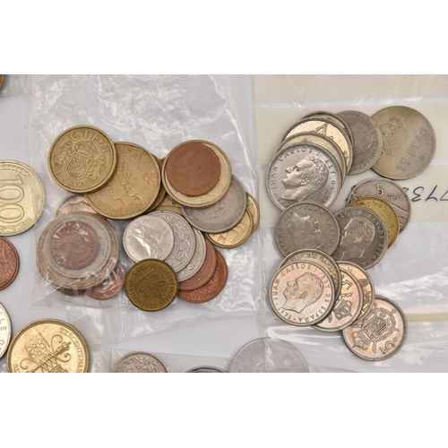 572 - A PLASTIC POT OF MIXED COINS TO INCLUDE A SILVER HINDU GOOD LUCK TOKEN etc