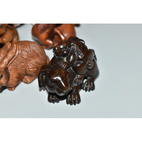 755 - EIGHT WOODEN NETSUKE, in the forms of various creatures, comprising a piglet riding a tortoise, a du... 