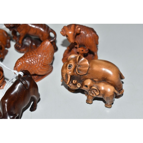 756 - EIGHT WOODEN NETSUKE, in the forms of various creatures, comprising an ox (tiny faults on its back),... 