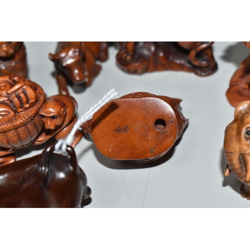 756 - EIGHT WOODEN NETSUKE, in the forms of various creatures, comprising an ox (tiny faults on its back),... 