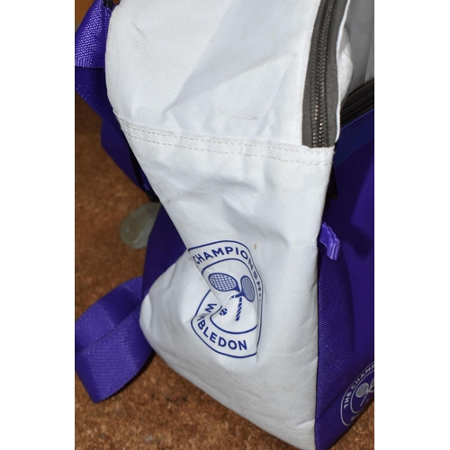 766 - A BABOLAT 'WIMBLEDON' TENNIS CHAMPIONSHIP SPORTS DUFFLE BAG, white and purple, can hold up to six te... 