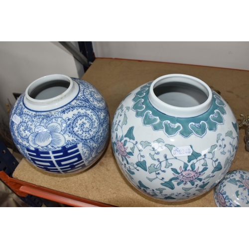 768 - TWO LARGE ORIENTAL STYLE GINGER JARS, comprising a blue and white covered jar with swirling fern des... 