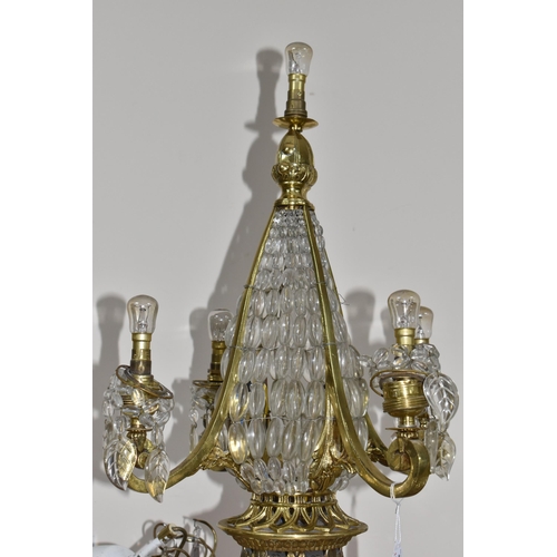 769 - A GROUP OF THREE CRYSTAL CHANDELIERS, possibly French, comprising two Regency style gilt metal ring ... 