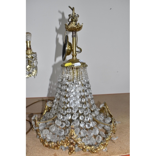 769 - A GROUP OF THREE CRYSTAL CHANDELIERS, possibly French, comprising two Regency style gilt metal ring ... 