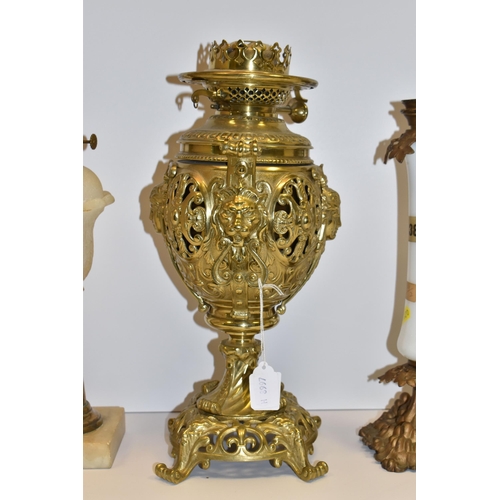 770 - THREE VICTORIAN OIL LAMP BASES, comprising a brass foliate design lamp base with lion mask handles, ... 