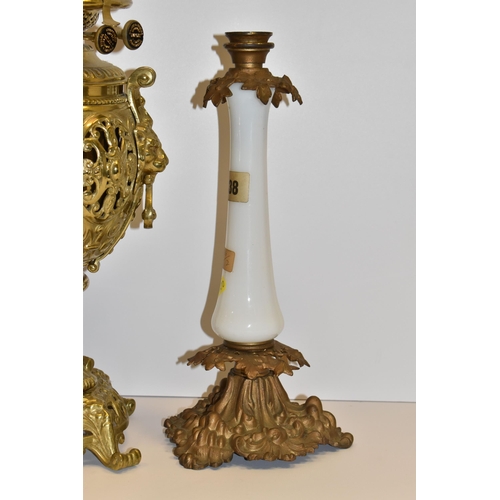 770 - THREE VICTORIAN OIL LAMP BASES, comprising a brass foliate design lamp base with lion mask handles, ... 