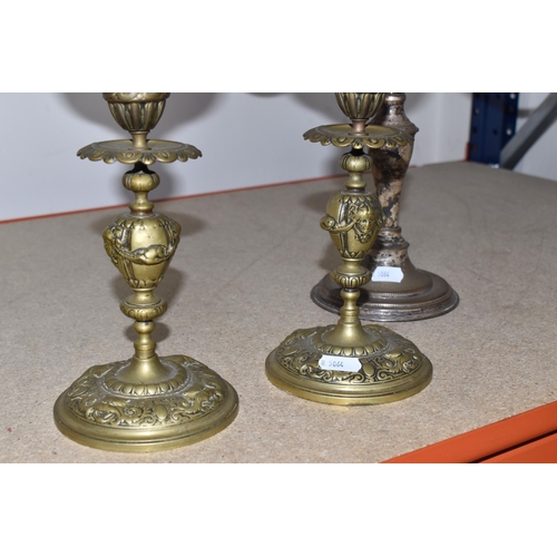 787 - FOUR BRASS AND CRANBERRY GLASS OIL LAMPS all with cranberry glass reservoirs, all have wick raiser k... 