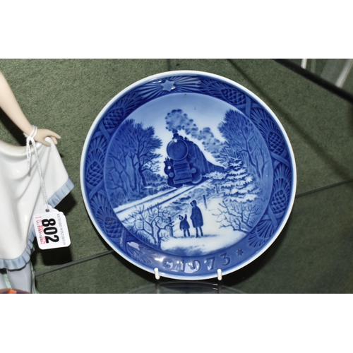 802 - A GROUP OF CERAMICS AND ENAMEL TRINKET BOXES, ETC, comprising a Nao figure of a lady holding her ski... 