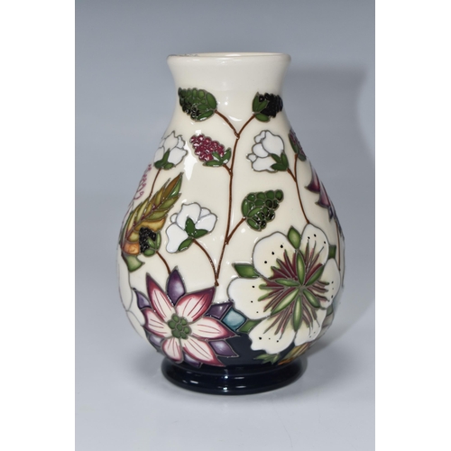 815 - A MOORCROFT POTTERY 'BRAMBLE REVISITED' BALUSTER VASE, tube-lined with a pattern of flowers and frui... 