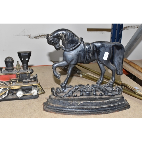 827 - A GROUP OF CAST IRON DOOR STOPS to include a pair of opposite facing black painted horses door stops... 