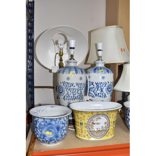 835 - A COLLECTION OF LARGE CERAMIC AND GLASS ITEMS to include three blue and white planters with floral d... 