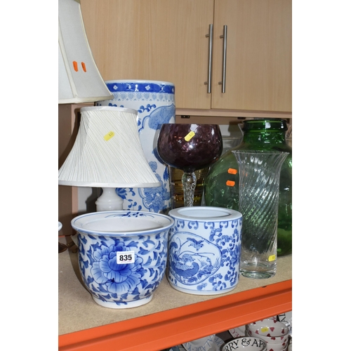 835 - A COLLECTION OF LARGE CERAMIC AND GLASS ITEMS to include three blue and white planters with floral d... 