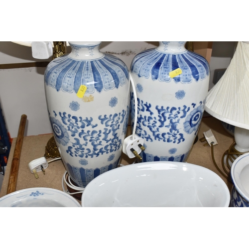 835 - A COLLECTION OF LARGE CERAMIC AND GLASS ITEMS to include three blue and white planters with floral d... 