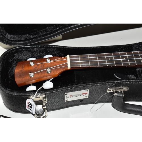 851 - A UKELELE AND A 3/4 SIZE LEFT-HANDED GUITAR, both have cases, comprising a Laka ukelele with built i... 