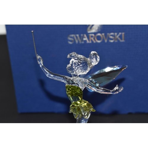 871 - A BOXED SWAROVSKI CRYSTAL 'TINKERBELL' SCULPTURE mounted on a frosted glass base, with iridescent wi... 