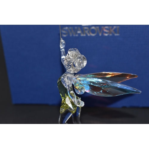 871 - A BOXED SWAROVSKI CRYSTAL 'TINKERBELL' SCULPTURE mounted on a frosted glass base, with iridescent wi... 