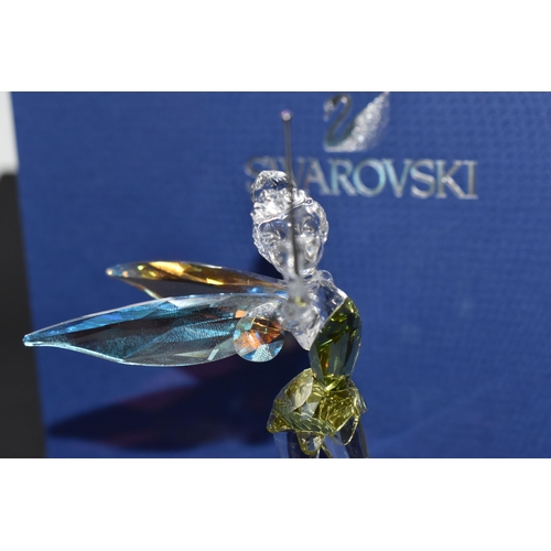 871 - A BOXED SWAROVSKI CRYSTAL 'TINKERBELL' SCULPTURE mounted on a frosted glass base, with iridescent wi... 