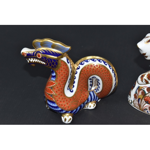 875 - TWO ROYAL CROWN DERBY PAPERWEIGHTS, comprising Bengal Tiger Cub and Dragon, each with gold stopper (... 