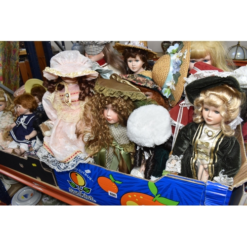 890 - THREE BOXES OF PORCELAIN HEADED ASSORTED DOLLS comprising approximately forty dolls in assorted peri... 