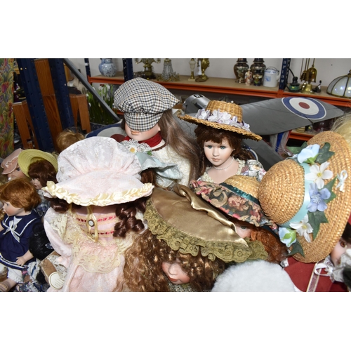 890 - THREE BOXES OF PORCELAIN HEADED ASSORTED DOLLS comprising approximately forty dolls in assorted peri... 