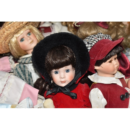 896 - TWO BOXES OF PORCELAIN DOLLS comprising approximately thirty assorted dolls in various period and tr... 