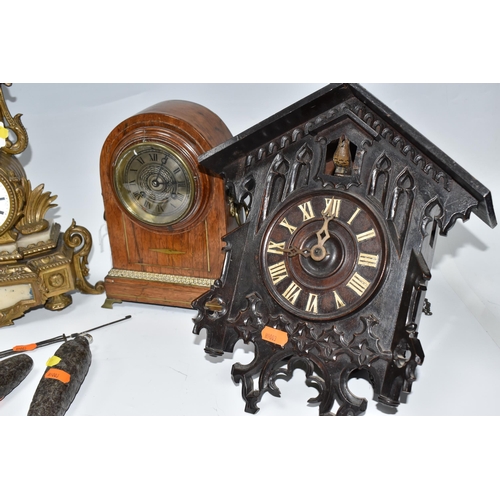 899 - TWO MANTEL CLOCKS AND A CUCKOO CLOCK, comprising a gilt French figural mantel clock, with a white po... 