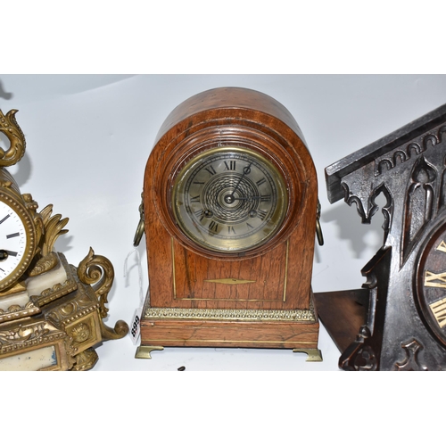 899 - TWO MANTEL CLOCKS AND A CUCKOO CLOCK, comprising a gilt French figural mantel clock, with a white po... 