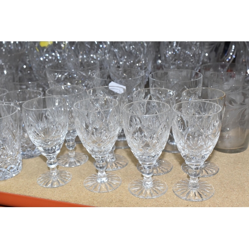 901 - A LARGE QUANTITY OF CUT GLASS, comprising a selection of various drinking glasses, vases, decanters ... 