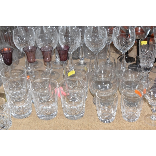 906 - A COLLECTION OF CUT GLASS ITEMS, comprising a selection of drinking glasses and decanters, to includ... 