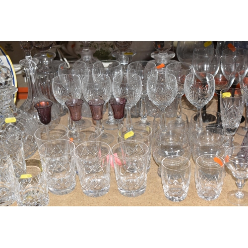 906 - A COLLECTION OF CUT GLASS ITEMS, comprising a selection of drinking glasses and decanters, to includ... 