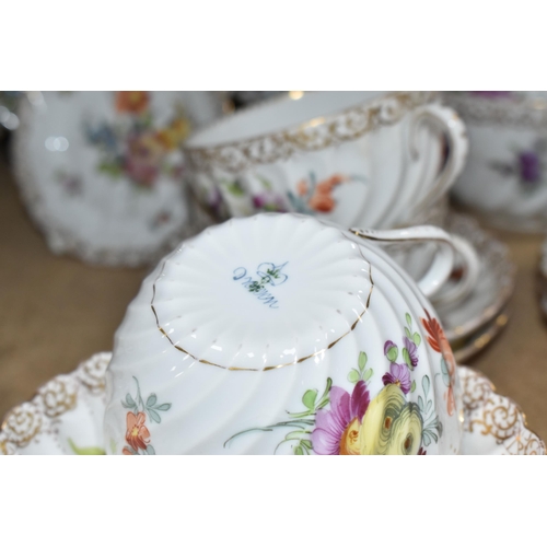 908 - A GROUP OF HAND-PAINTED DRESDEN TEA WARE, hand painted with various floral designs and gilt pattern ... 