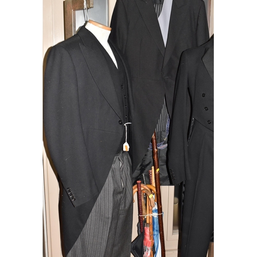 914 - THREE EARLY/MID CENTURY GENTLEMEN'S MORNING SUITS TOGETHER WITH A COLLECTION OF WALKING STICKS AND U... 