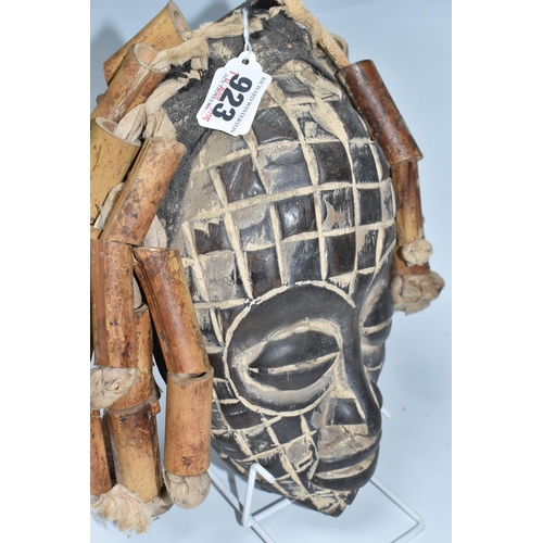 923 - A CHOKWE MWANA PWO MASK, ANGOLA with hand-carved grid patterns, fifteen bamboo 'hair' strands strung... 