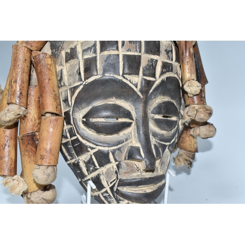 923 - A CHOKWE MWANA PWO MASK, ANGOLA with hand-carved grid patterns, fifteen bamboo 'hair' strands strung... 