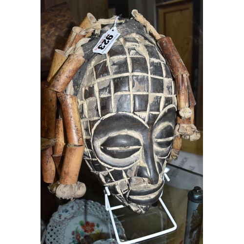 923 - A CHOKWE MWANA PWO MASK, ANGOLA with hand-carved grid patterns, fifteen bamboo 'hair' strands strung... 